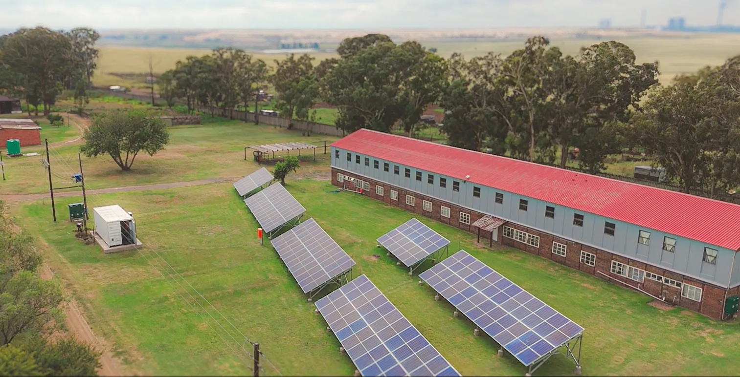 Solar panels installed beside a community building